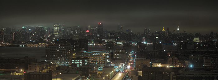 night view of foggy hoboken and new york, empire state building truncated by fog